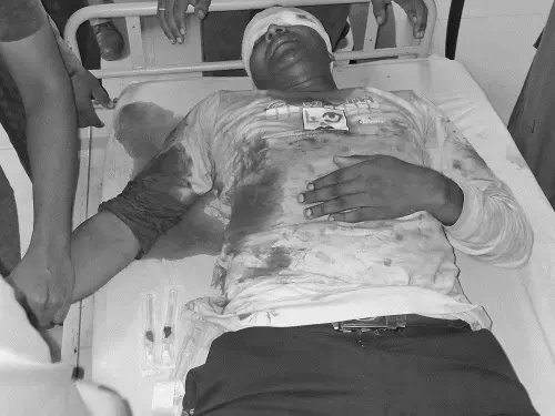 मलिहाबाद में LIC एजेंट पर फायरिंग की घटना के बाद मौके पर पुलिस।